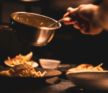 image of a chef preparing dishes